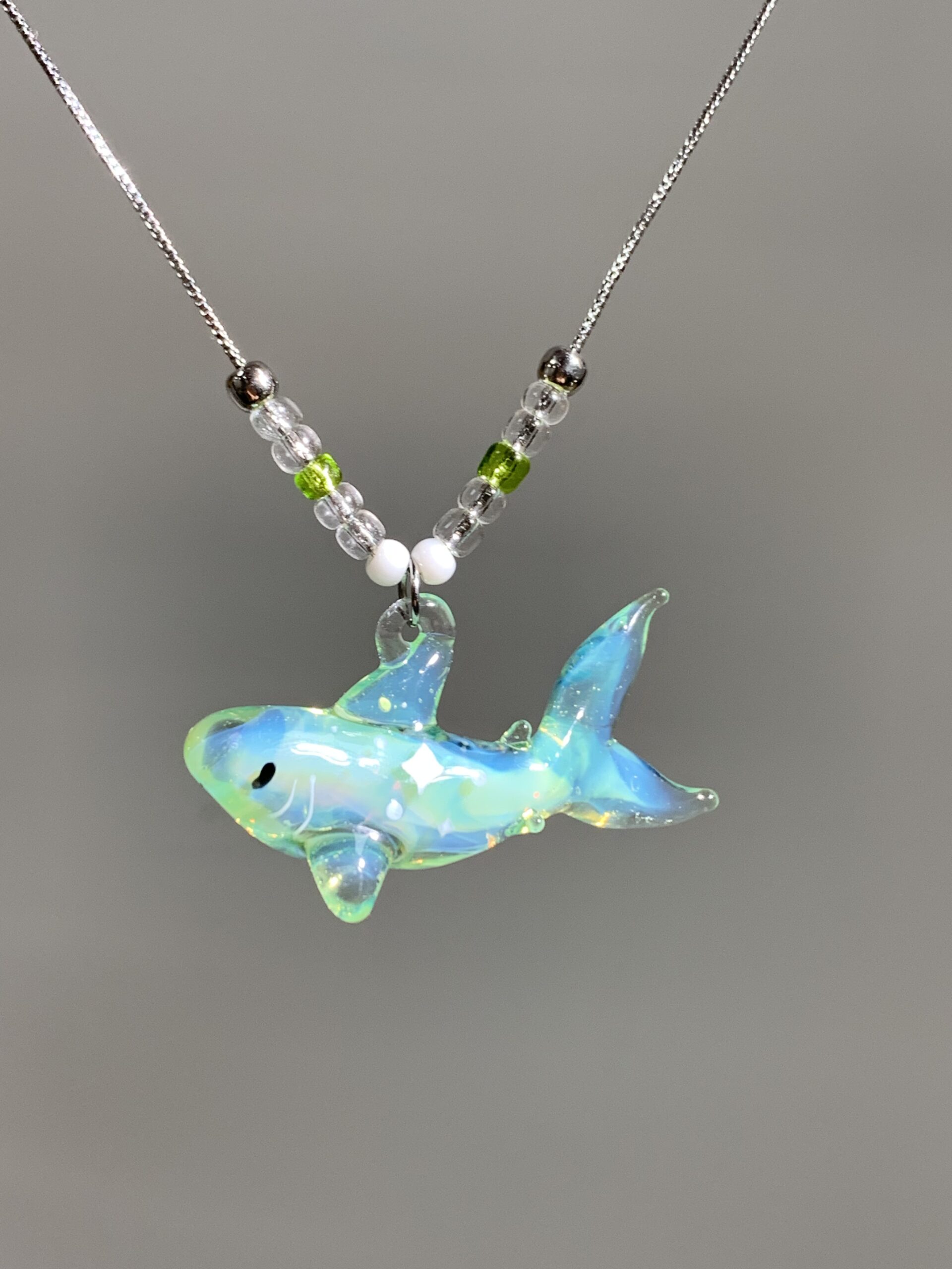 “Green Shark – Handmade Marine Creature Necklace, Offering Good Wishes from the Sea.”